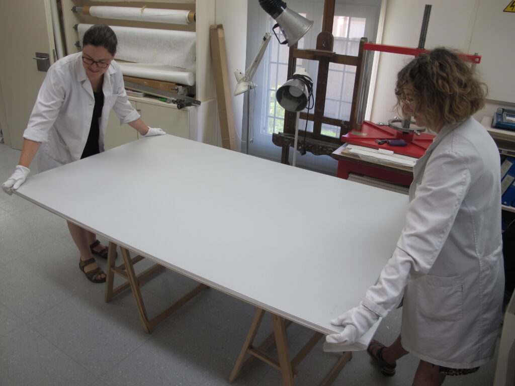 Placement of large-format drawings in individual conservation boxes